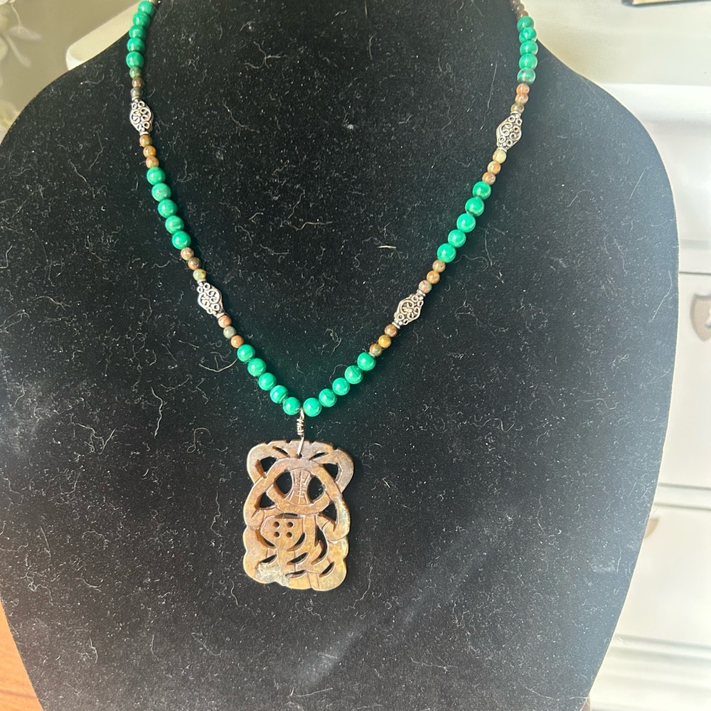Green Beaded Necklace with Carved Stone Pendant